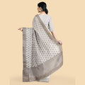 Cloud grey synthetic chanderi silk saree with embroidery & stones in floral design. Blouse piece in same colour-D12748