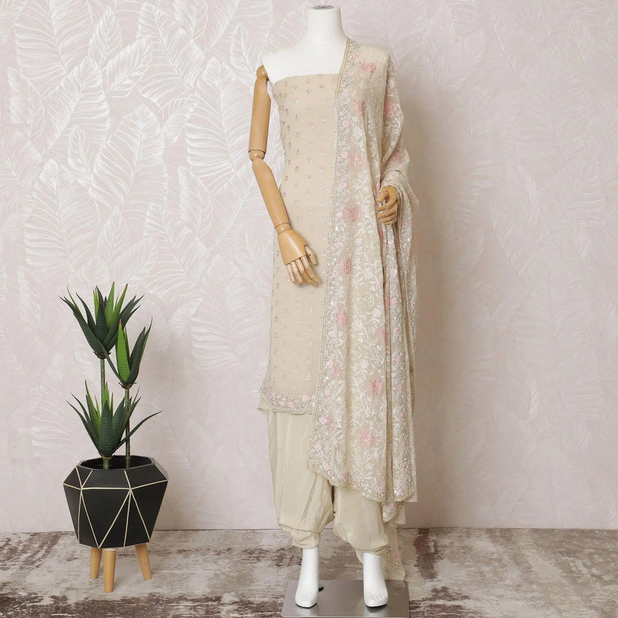 Light beige silk georgette kameez with multicolor embroidery, bead work and sequin work in floral design. Light beige plain salwar with same tone georgette dupatta having multicolor embroidery and stone work-D15523 Regal Fabrics