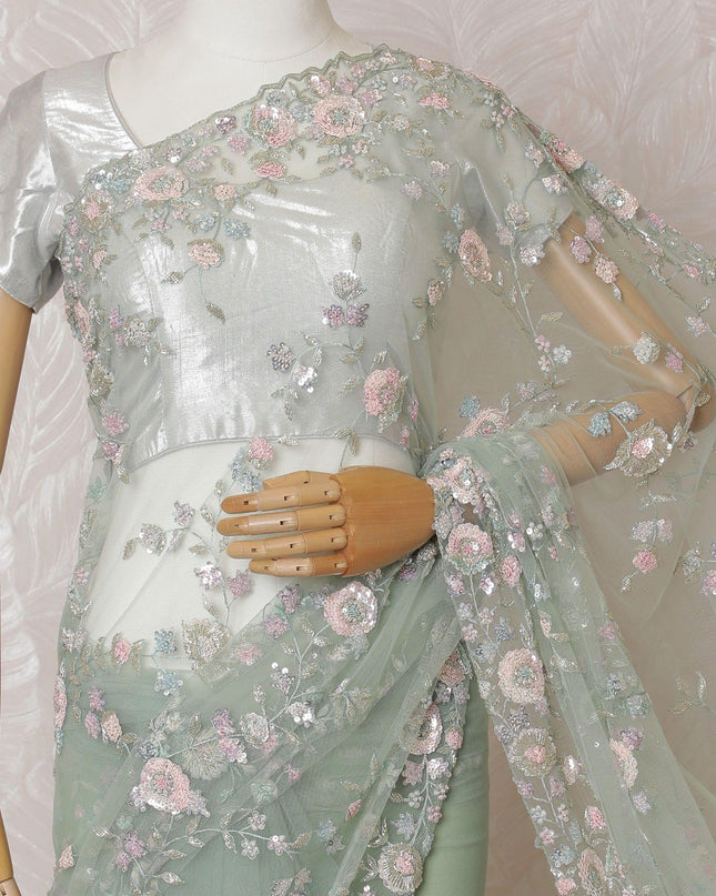 Mint green Premium net saree with same tone embroidery having baby pink sequin work and gold bead work in floral design-D15587