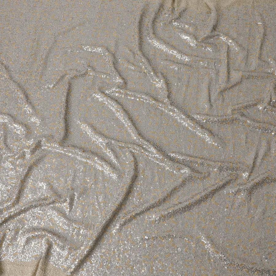 قماش محبوك باللون البيج شانتاريل مع ترتر فضي وذهبي بتصميم تجريدي