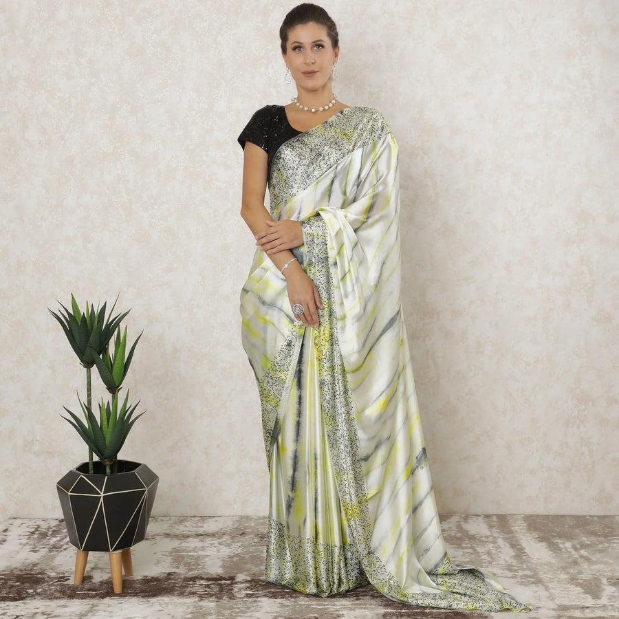 Off white Premium pure silk satin saree with lemon yellow, black, grey tie & die print having stone work in fancy design-12566 Regal Fabrics