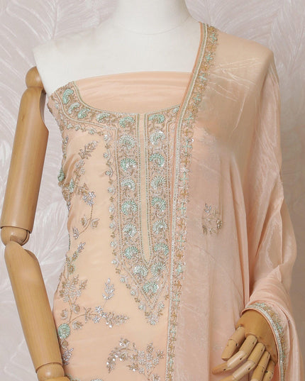 Light peach Premium pure silk crepe kameez with mint green embroidery, sequin work and stone work in floral design. Light peach plain salwar with same tone chiffon dupatta with same tone embroidery and bead work-D15577