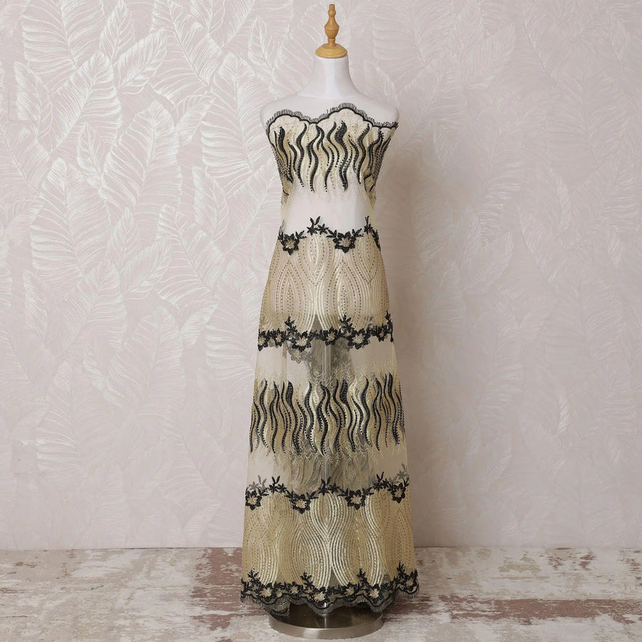 Gold nylon tulle fabric with same tone, black embroidery having stone work in fancy design-D14710 Regal Fabrics