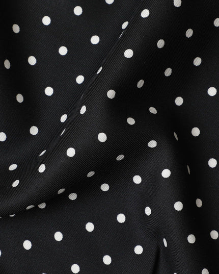 Black viscose crepe printed fabric with white prints in polka dot design-D11157