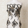 Gold nylon tulle fabric with same tone, black embroidery having stone work in floral design-D12221