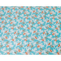 Maya blue uragiri cotton voile fabric with same tone jacquard having grey, squash orange and olive green print in floral deisgn-D10484
