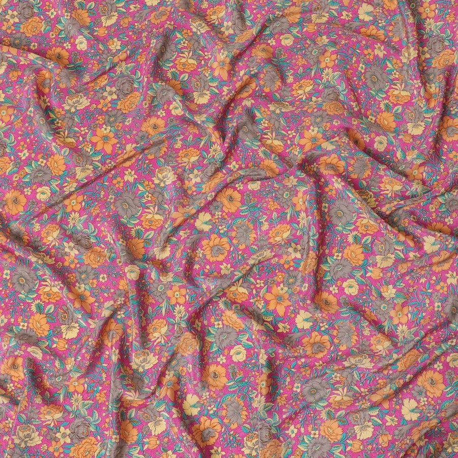 Magenta pink silk crepe fabric with light orange, blue and cream prints in floral design - D9908