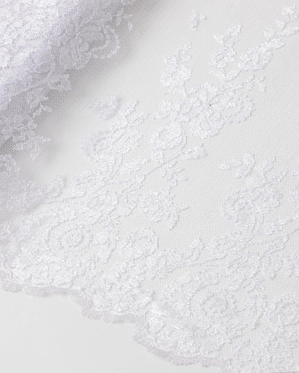 White lace fabric with white embroidery in floral design