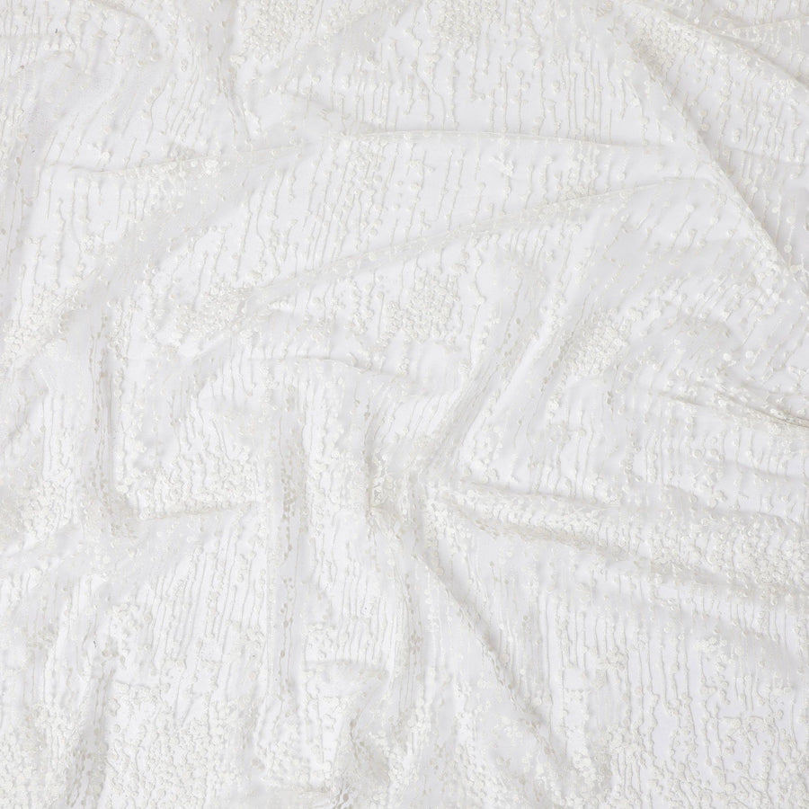 White nylon tulle fabric with same tone flock having glitter in fancy design-D13990 Regal Fabrics
