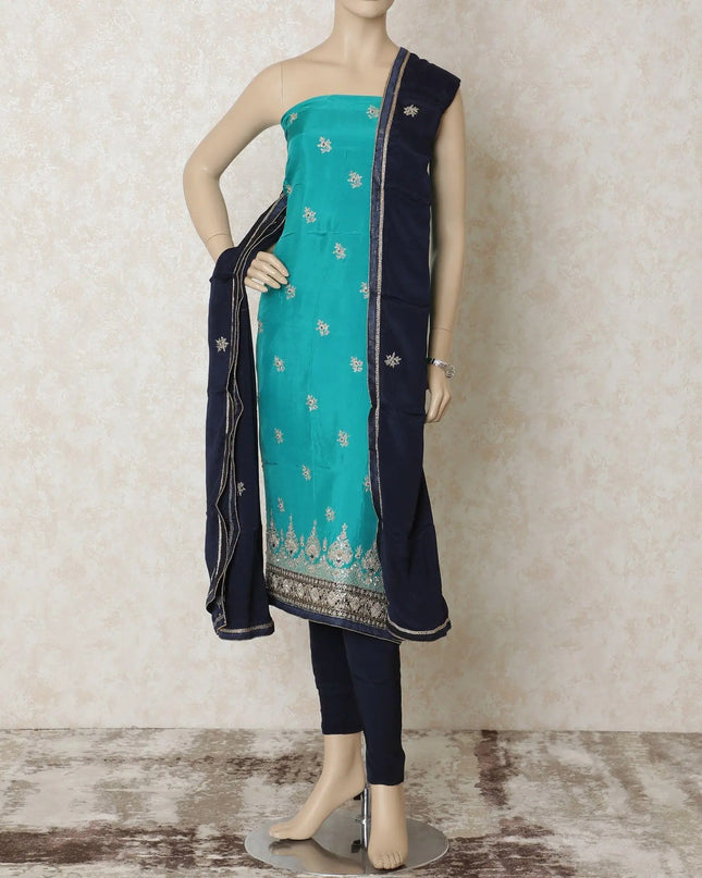 Turquoise blue silk kameez with gold embroidery having sequin work and bead work in floral design. Navy blue plain salwar having same tone chiffon dupatta with gold bead work-D12697 Regal Fabrics
