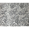 Daisy white Rayon velvet fabric with black, pewter grey print having metallic silver studs in abstract design