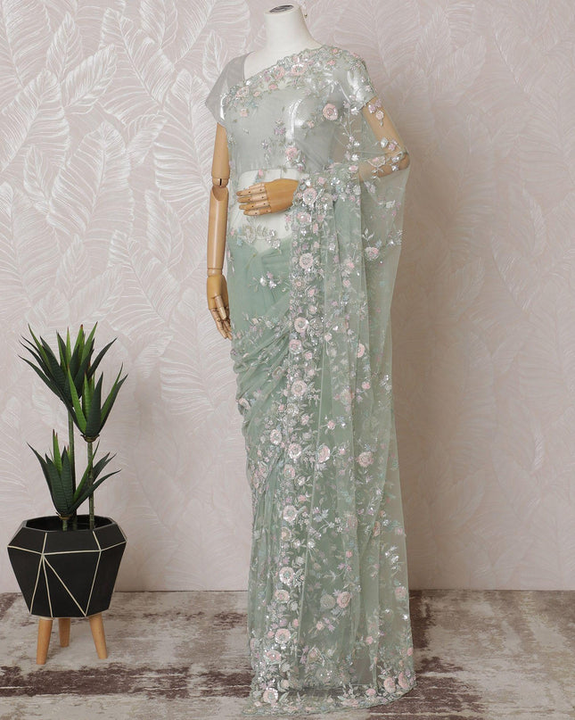 Mint green Premium net saree with same tone embroidery having baby pink sequin work and gold bead work in floral design-D15587