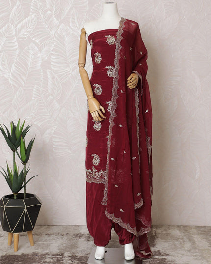 Ruby red silk crepe kameez with gold embroidery, sequins and bead work in floral design. Ruby red plain salwar with same tone flat chiffon dupatta having gold embroidery and mirror work-D15530