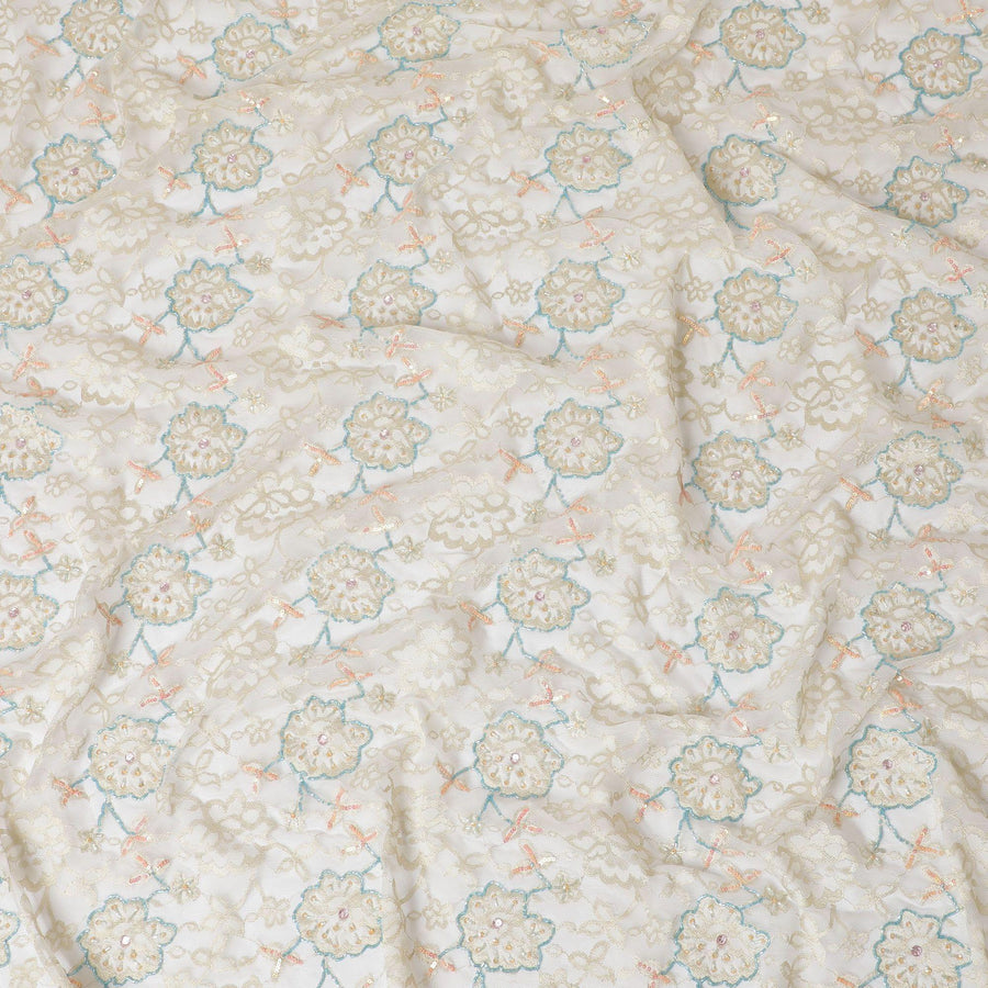 Beige nylon tulle fabric with same tone embroidery having baby blue bead work and peach sequins in floral design-D15168