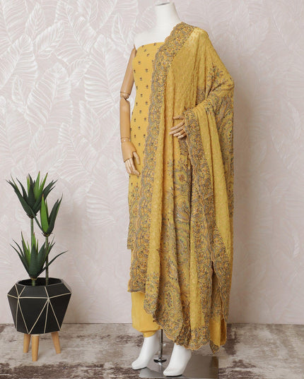 Mustard yellow silk georgette kameez with multicolor embroidery, bead work and stone work in paisley design. Mustard yellow plain salwar with same tone georgette dupatta with multicolor embroidery and stone work-D15525