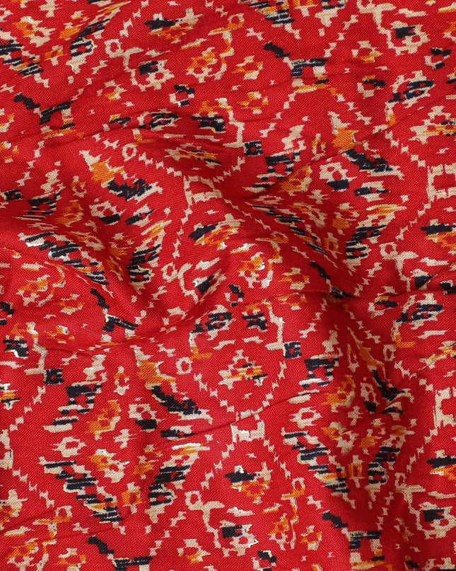 Crimson red cotton viscose fabric with black, orange and gold print in batik design-D14192 Regal Fabrics