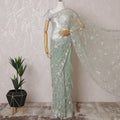 Mint green Premium net saree with same tone embroidery having baby pink sequin work and gold bead work in floral design-D15587