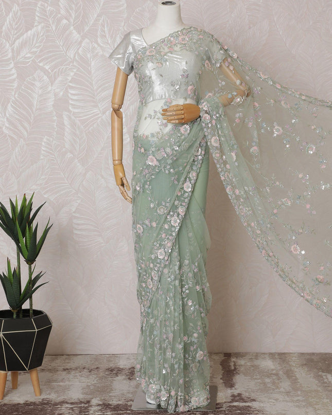 Mint green Premium net saree with same tone embroidery having baby pink sequin work and gold bead work in floral design-D15587