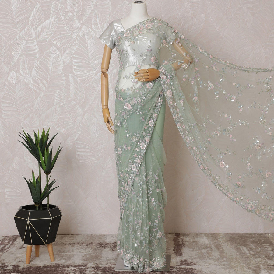 Mint green Premium net saree with same tone embroidery having baby pink sequin work and gold bead work in floral design-D15587