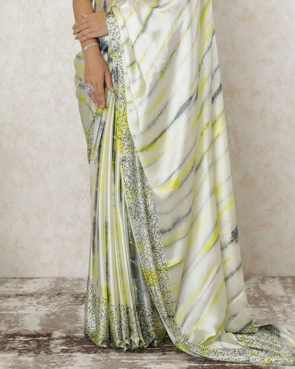 Off white Premium pure silk satin saree with lemon yellow, black, grey tie & die print having stone work in fancy design-12566 Regal Fabrics