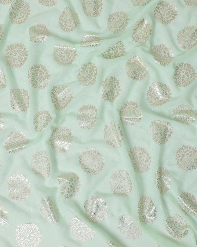 Mint green synthetic georgette fabric with same tone embroidery having gold foil printed in floral design-D12228 Regal Fabrics