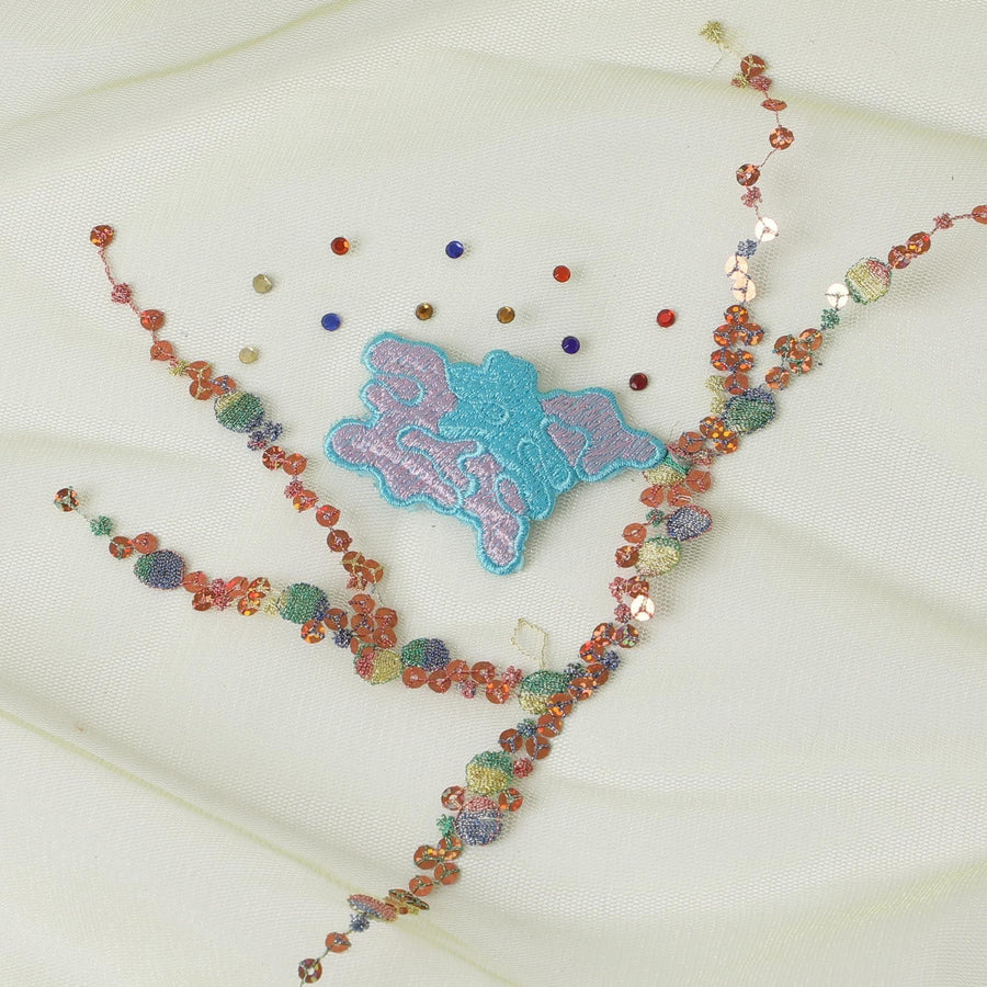 Lime green nylon tulle fabric with multi color embroidery and multi color sequins in abstract design