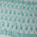 Aqua marine blue synthetic organza fabric with same color embroidery in fancy design