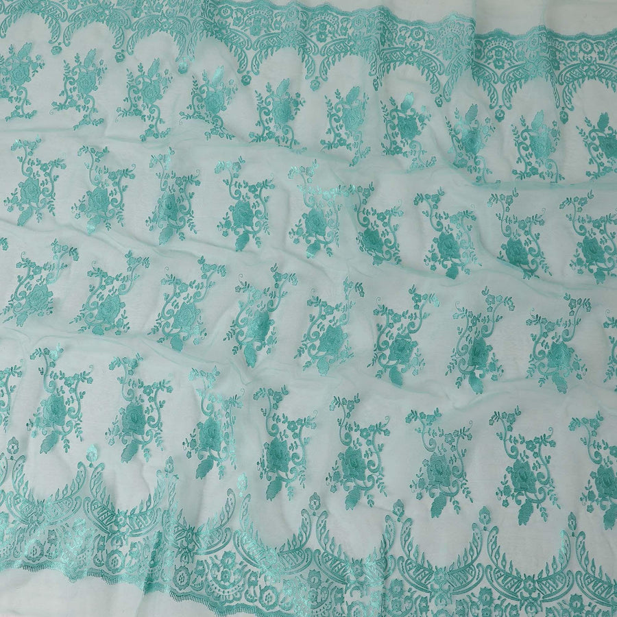 Aqua marine blue synthetic organza fabric with same color embroidery in fancy design