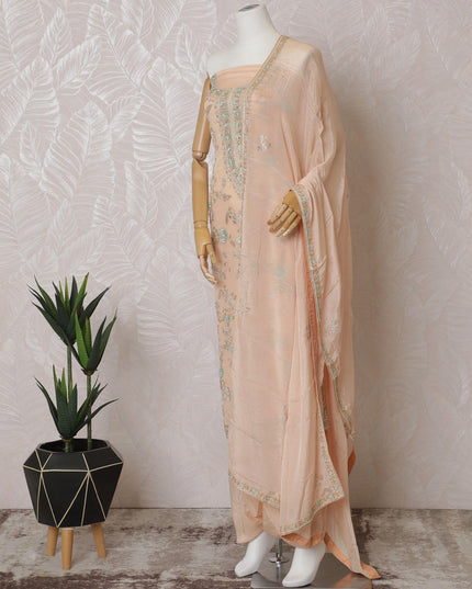 Light peach Premium pure silk crepe kameez with mint green embroidery, sequin work and stone work in floral design. Light peach plain salwar with same tone chiffon dupatta with same tone embroidery and bead work-D15577