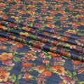 Petrol blue tussar silk fabric with olive green, tangerine orange, blonde yellow and light plum print in floral design-D6140 Regal Fabrics