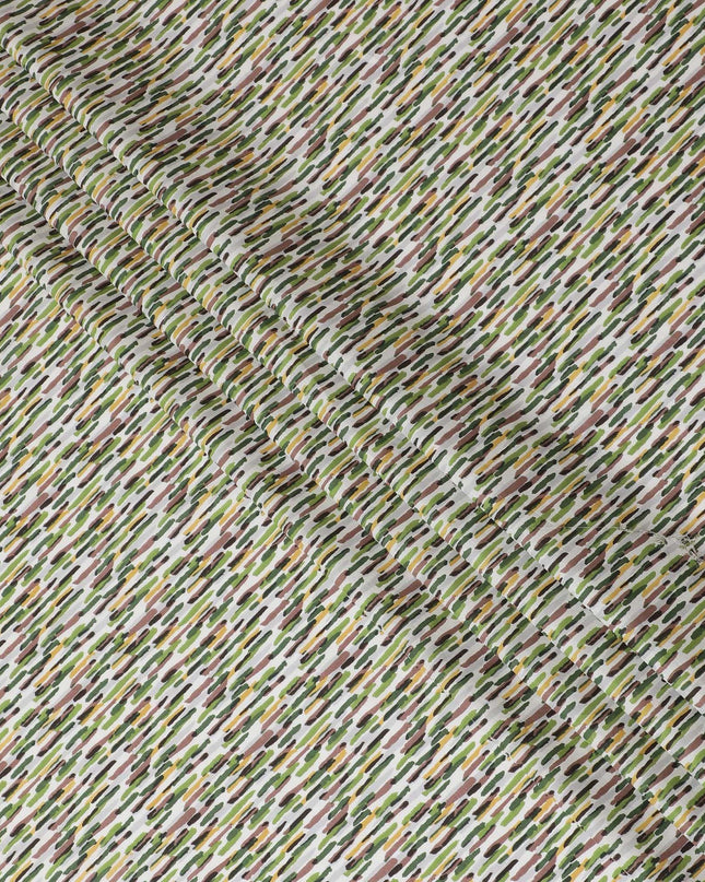 Off white cotton lawn fabric with lime green, pale brown and green print in fancy design-D15228