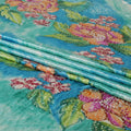 Turquoise blue to cerulean blue Rayon velvet fabric having white and yellow stonework in floral design