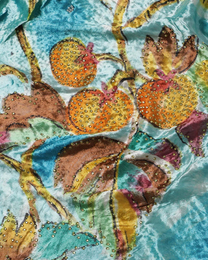 Arctic blue to sky blue Rayon velvet fabric with multicolor print having yellow and green stonework in leaf design