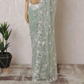 Mint green Premium net saree with same tone embroidery having baby pink sequin work and gold bead work in floral design-D15587