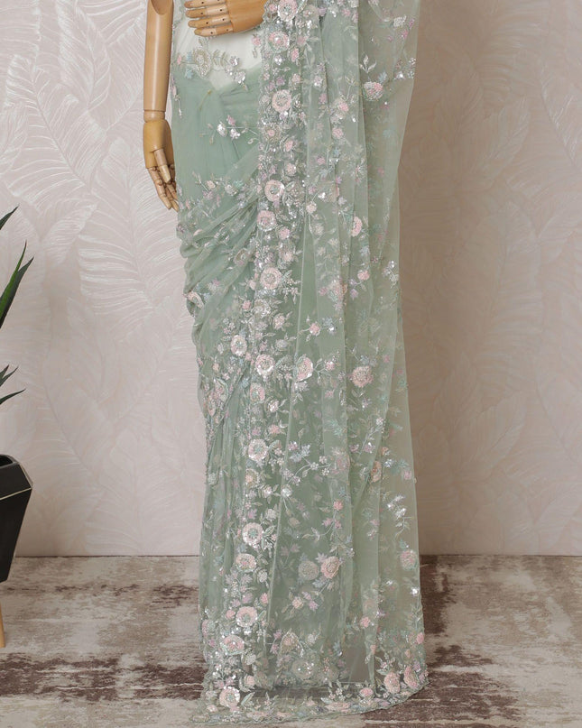 Mint green Premium net saree with same tone embroidery having baby pink sequin work and gold bead work in floral design-D15587