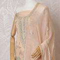 Light peach Premium pure silk crepe kameez with mint green embroidery, sequin work and stone work in floral design. Light peach plain salwar with same tone chiffon dupatta with same tone embroidery and bead work-D15577 Regal Fabrics