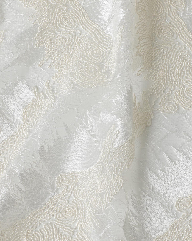 Ivory nylon tulle fabric with same tone, off white embroidery in fancy design