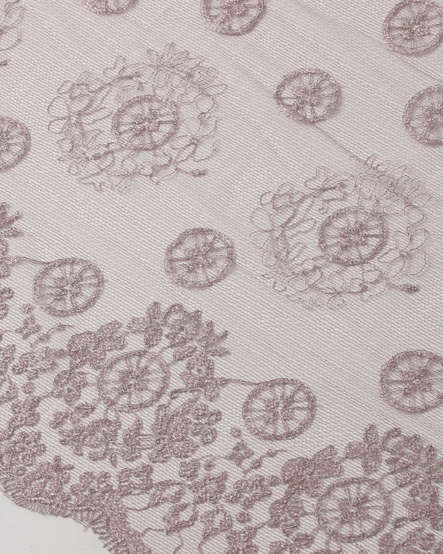 Light rouge pink nylon tulle fabric with embroidery in fancy, floral and circular design