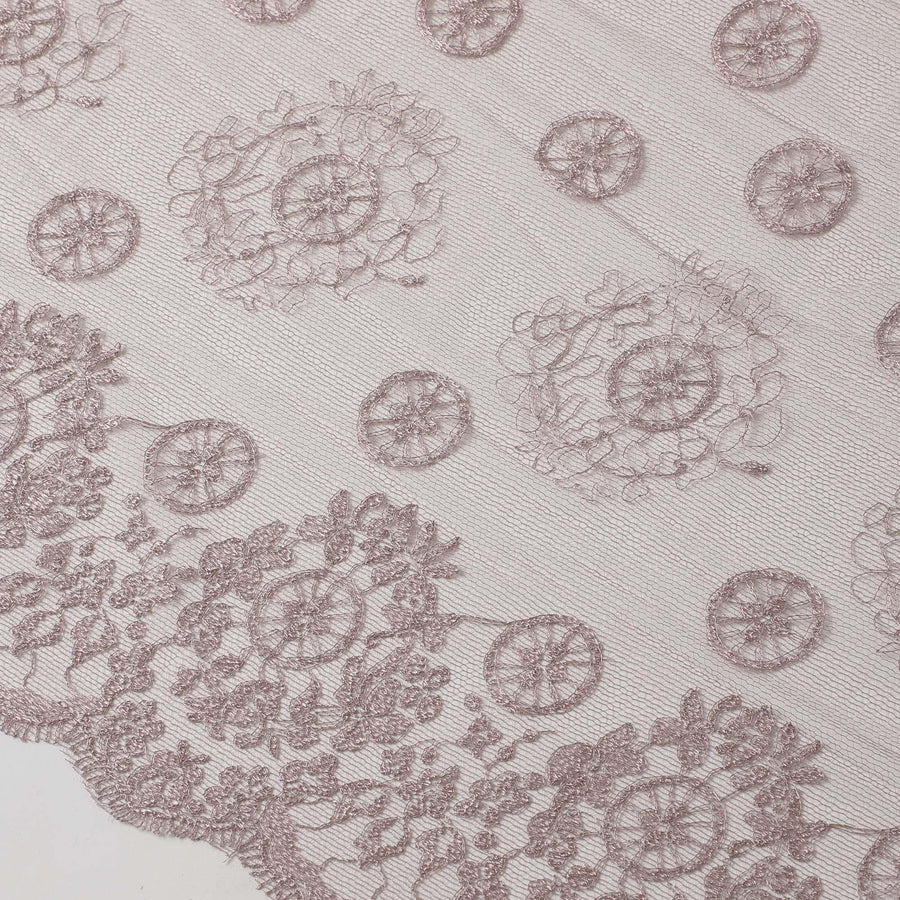 Light rouge pink nylon tulle fabric with embroidery in fancy, floral and circular design