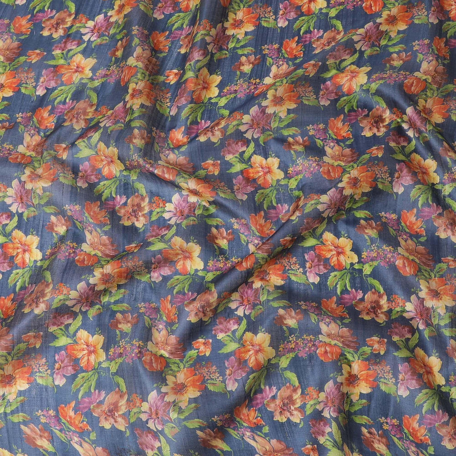 Petrol blue tussar silk fabric with olive green, tangerine orange, blonde yellow and light plum print in floral design-D6140 Regal Fabrics