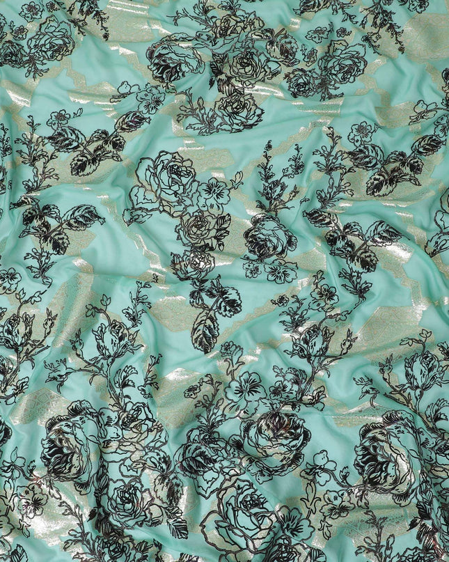 Light teal premium pure silk chiffon fabric with black flock having glitter and gold metallic lurex in floral design-D13723