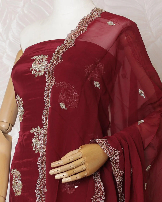 Ruby red silk crepe kameez with gold embroidery, sequins and bead work in floral design. Ruby red plain salwar with same tone flat chiffon dupatta having gold embroidery and mirror work-D15530 Regal Fabrics