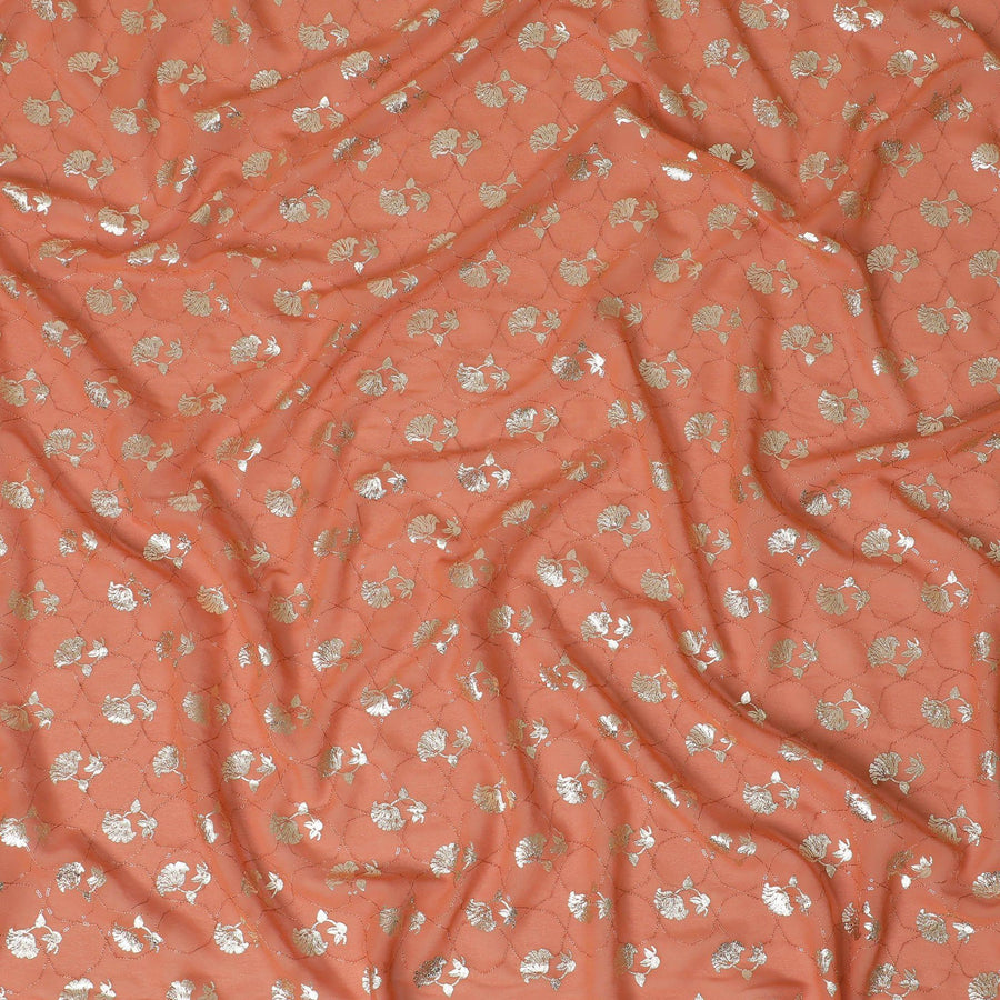 Creamsicle orange synthetic georgette fabric with same tone embroidery having gold foil print in floral design-D12032