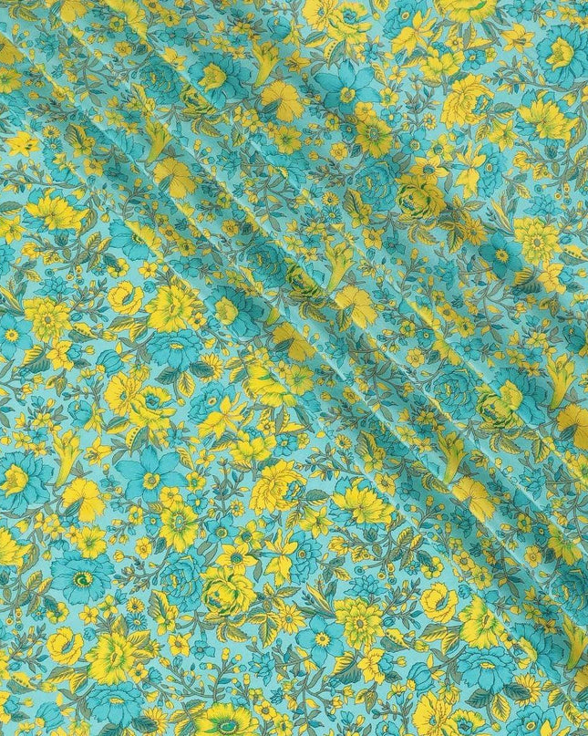 Turquoise blue silk crepe fabric with yellow, green and blye prints in floral design - D9911 Regal Fabrics