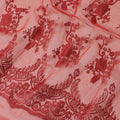Rose red synthetic organza fabric with same shade embroidery in fancy design