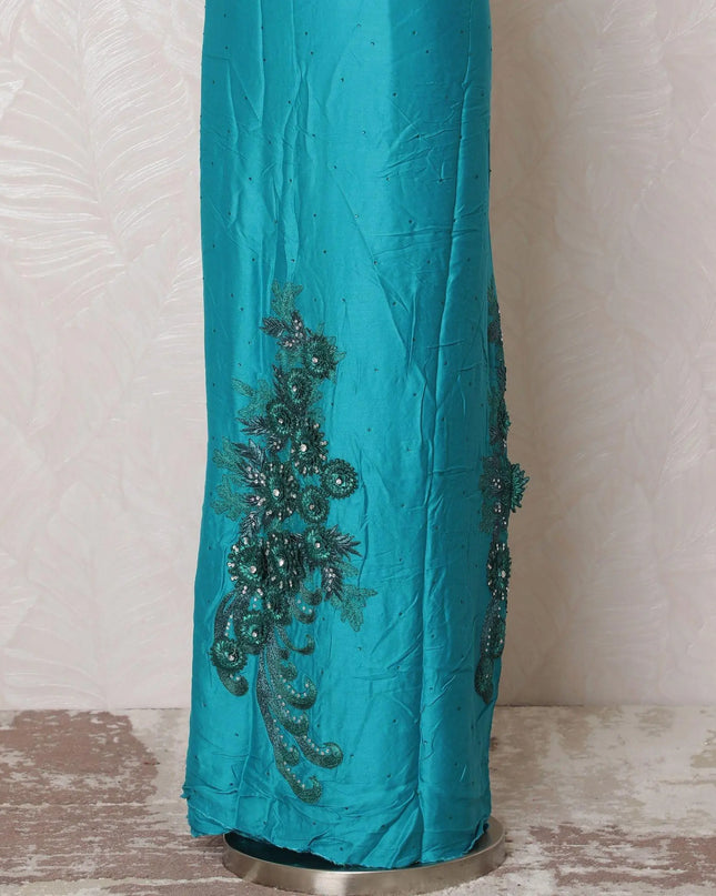 Teal blue blended cotton lawn fabric with same tone, forest green embroidery having applique work and stone work in floral design-D15076 Regal Fabrics