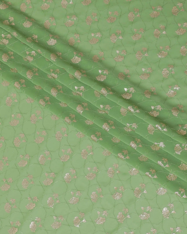 Sage green synthetic georgette fabric with same tone embroidery having gold foil print in floral design-D12030 Regal Fabrics