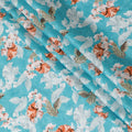 Maya blue uragiri cotton voile fabric with same tone jacquard having grey, squash orange and olive green print in floral deisgn-D10484