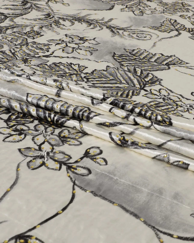Macaroon Beige Rayon velvet fabric with charcoal grey print having green and silver stonework in leaf design Regal Fabrics