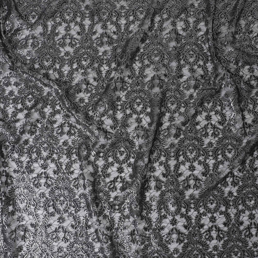 Black nylon tulle fabric with silver embroidery in fancy design